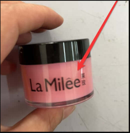 La Milée moisturizing lip cream in a pink container, designed for hydrating and soothing lips.