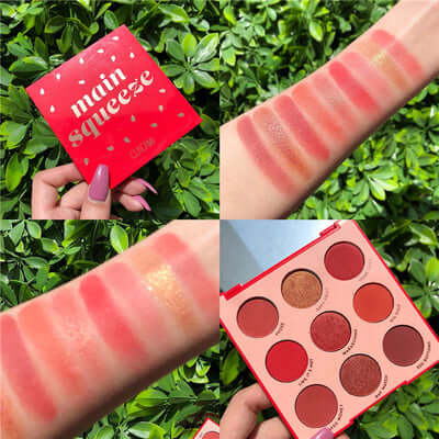Main Squeeze eyeshadow palette showing swatches with vibrant red tones on arm and product packaging on a leafy background.