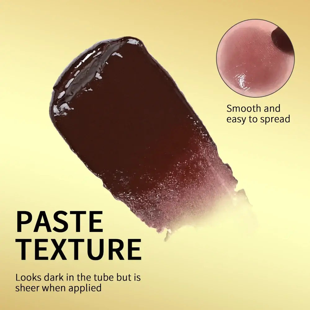 Swatch of black honey lipstick showing creamy paste texture, dark in tube but sheer when applied.