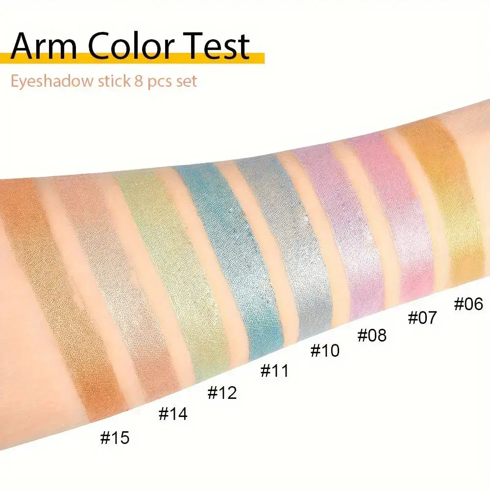Arm color test showing swatches of 8 eyeshadow sticks in various shimmering shades.
