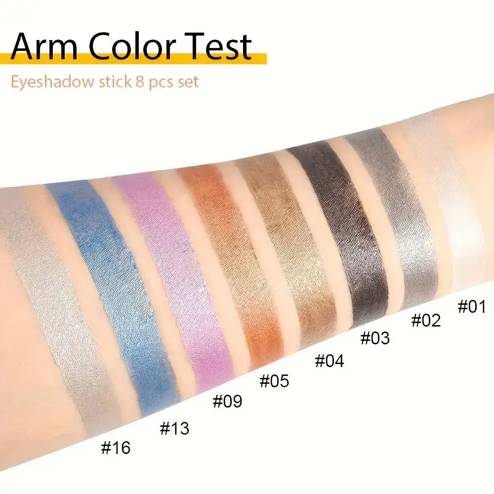Swatches of eight eyeshadow stick colors on arm showcasing vibrant shades for makeup application.