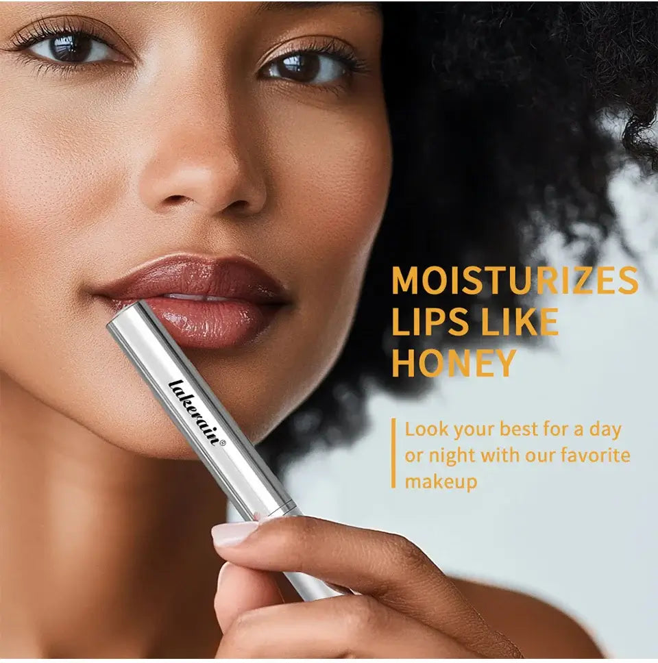 Model using long lasting black honey lipstick to moisturize lips, promoting smooth and nourished lips.