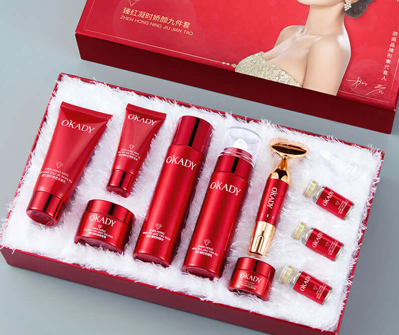High-end skin care products set in a red box including cleanser, toner, essence, and cream.