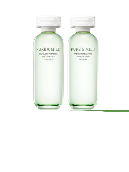 Pure & Mild moisturizing lotion set in green bottles for natural summer skincare.