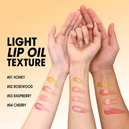 Light lip oil texture on arms showcasing shades: Honey, Rosewood, Raspberry, and Cherry.